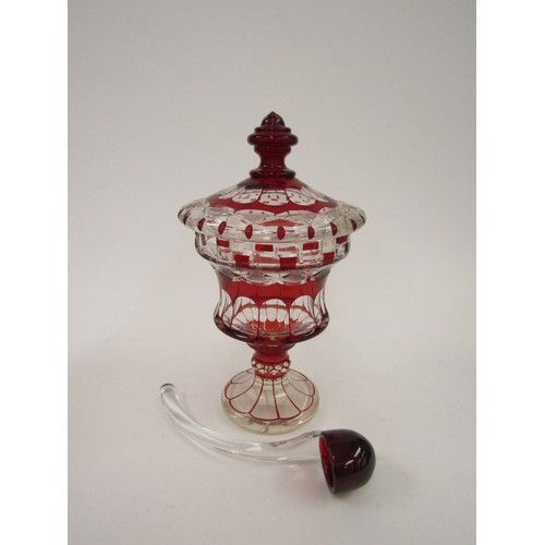 4326 - A ruby and clear glass pedestal jar and cover with ladle, 30cm tall    (R) £150