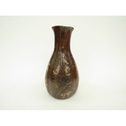 4346 - A Martin Brothers salt glazed vase, floral decoration on a brown ground, some restoration to top rim... 