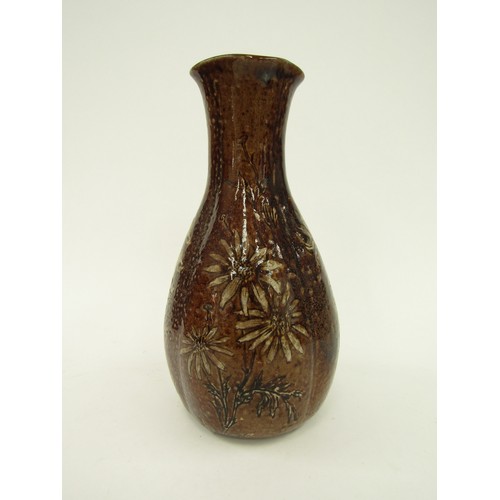 4346 - A Martin Brothers salt glazed vase, floral decoration on a brown ground, some restoration to top rim... 