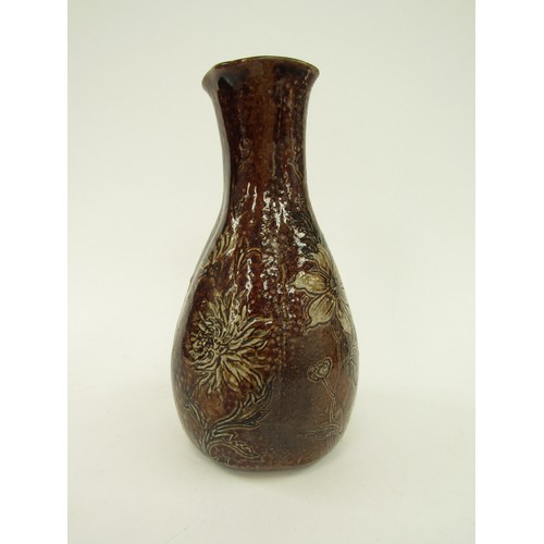 4346 - A Martin Brothers salt glazed vase, floral decoration on a brown ground, some restoration to top rim... 