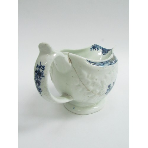 4341 - A Lowestoft blue and white sauce boat, Circa 1760-70 with moulded sides, flower cartouche and printe... 