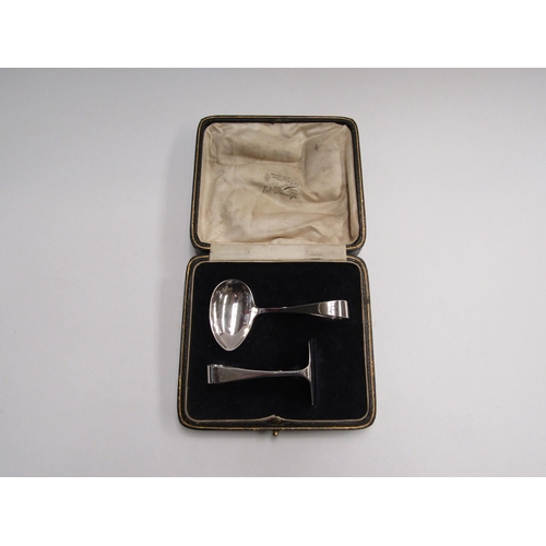 4344 - A cased silver child's feeding spoon and pusher