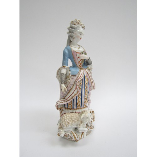 4362 - A late 18th/ early 19th Century porcelain figure of a lady, recumbent sheep at her feet. Well colour... 