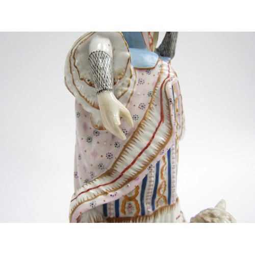 4362 - A late 18th/ early 19th Century porcelain figure of a lady, recumbent sheep at her feet. Well colour... 