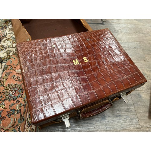 4231 - A 1908 crocodile skin gents travel case with grooming set contents, monogrammed M.S, with travel cov... 