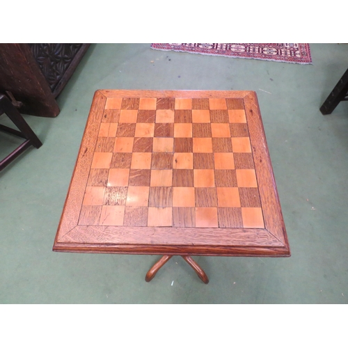 4009 - An early 20th Century games table with chessboard top, 72cm high x 34cm squared top   (R) £40