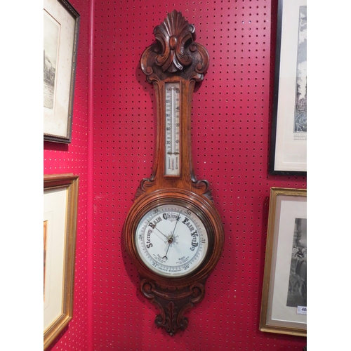 4067 - A carved oak banjo barometer