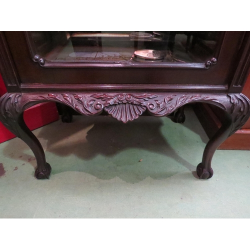 4072 - A mahogany carved mirror backed display cabinet on cabriole legs with ball and claw feet.  No key. 1... 