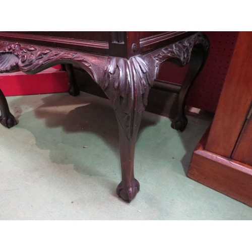 4072 - A mahogany carved mirror backed display cabinet on cabriole legs with ball and claw feet.  No key. 1... 