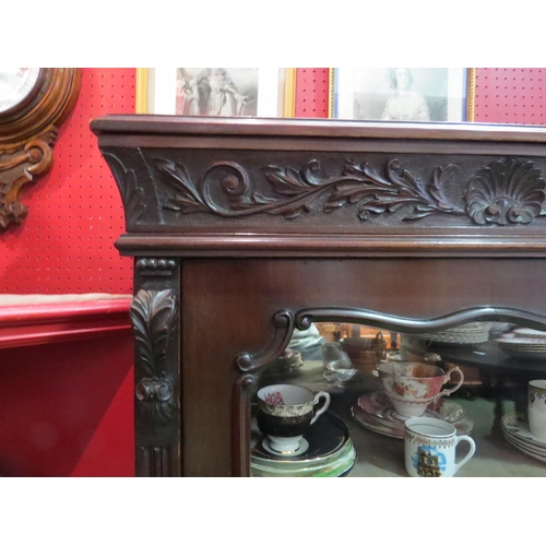 4072 - A mahogany carved mirror backed display cabinet on cabriole legs with ball and claw feet.  No key. 1... 