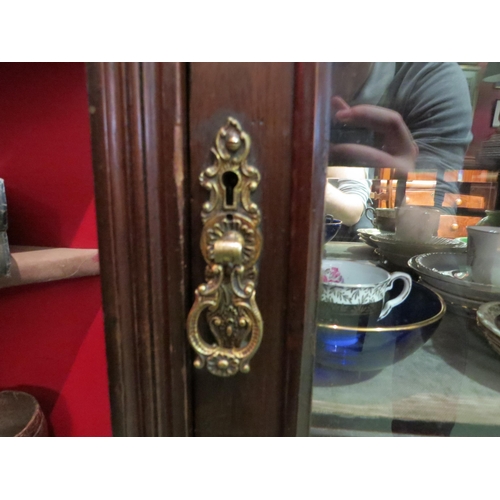 4072 - A mahogany carved mirror backed display cabinet on cabriole legs with ball and claw feet.  No key. 1... 