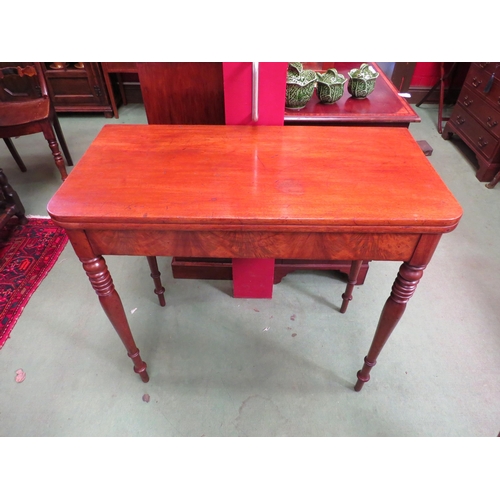 4081 - An early Victorian mahogany fold-over top side table on fine ring-turned and tapering leg supports  ... 