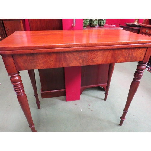 4081 - An early Victorian mahogany fold-over top side table on fine ring-turned and tapering leg supports  ... 