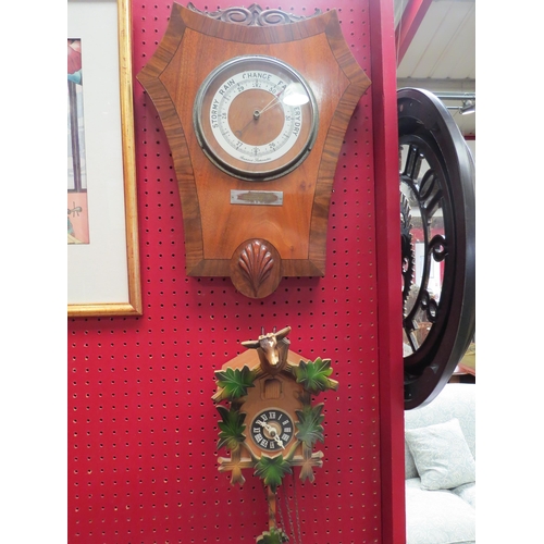 4115 - A 1930's mahogany and walnut Aneroid Barometer with presentation plaque and a German cuckoo clock (2... 