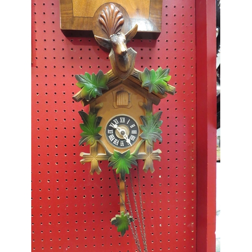 4115 - A 1930's mahogany and walnut Aneroid Barometer with presentation plaque and a German cuckoo clock (2... 