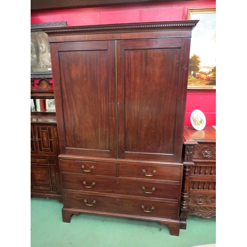 4142 - A George III flame mahogany linen press with dentil cornice over two doors (with key), opening to re... 