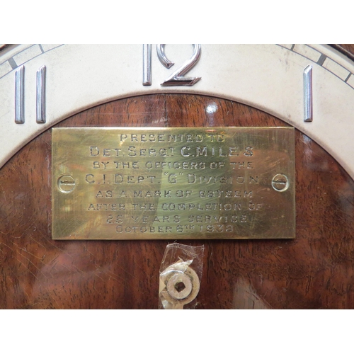 4148 - A Westminster chime three train walnut mantel clock with presentation plaque to dial, minute hand lo... 