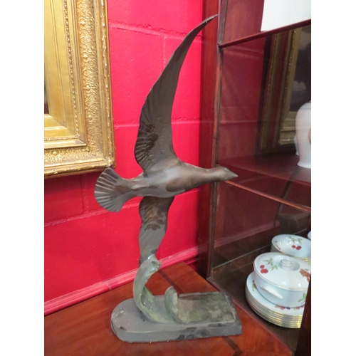 4149 - A spelter figure of seagull riding a wave, 65cm high x 30cm wide