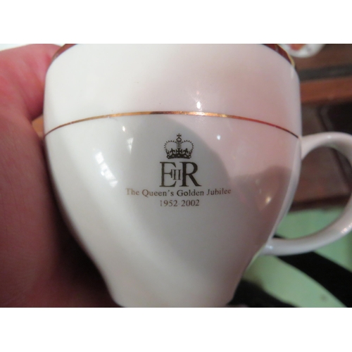 4153 - A selection of white ground and gilt Queen Elizabeth II golden jubilee Royal commemorative tea wares... 