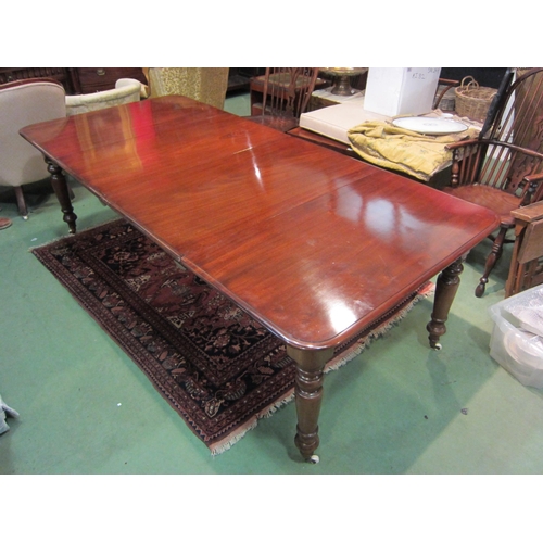 4185 - A Victorian style mahogany round cornered top extending dining table having two extra leaves and bra... 