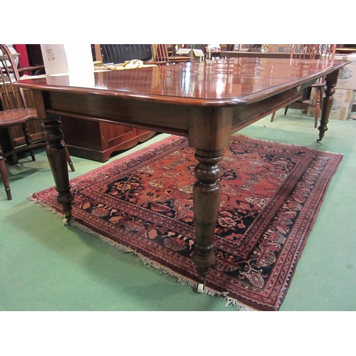 4185 - A Victorian style mahogany round cornered top extending dining table having two extra leaves and bra... 