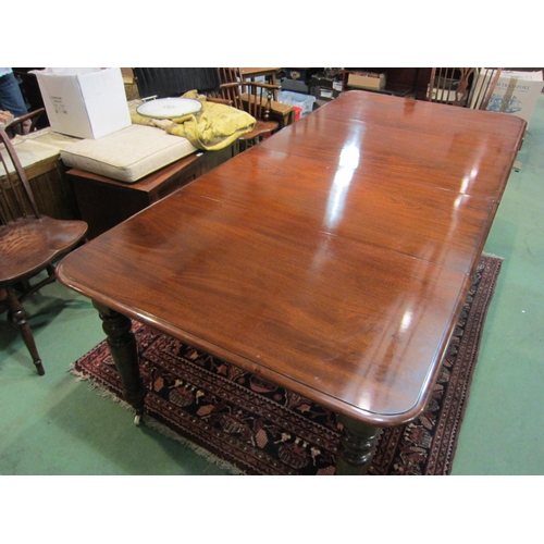 4185 - A Victorian style mahogany round cornered top extending dining table having two extra leaves and bra... 