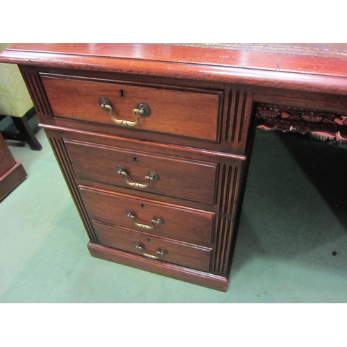 4197 - A Georgian revival mahogany twin pedestal desk, the tooled leather insert over eight drawers with br... 