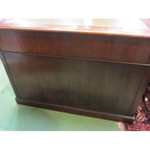 4197 - A Georgian revival mahogany twin pedestal desk, the tooled leather insert over eight drawers with br... 