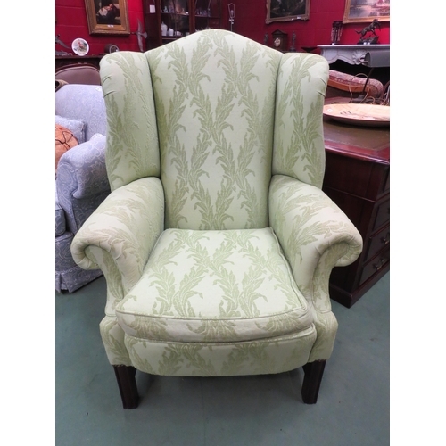 4189 - A pair of George III style wing back armchairs with scroll arms and feather filled cushions on reede... 