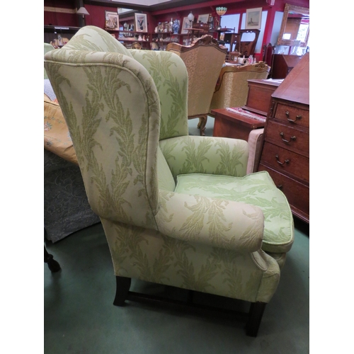 4189 - A pair of George III style wing back armchairs with scroll arms and feather filled cushions on reede... 