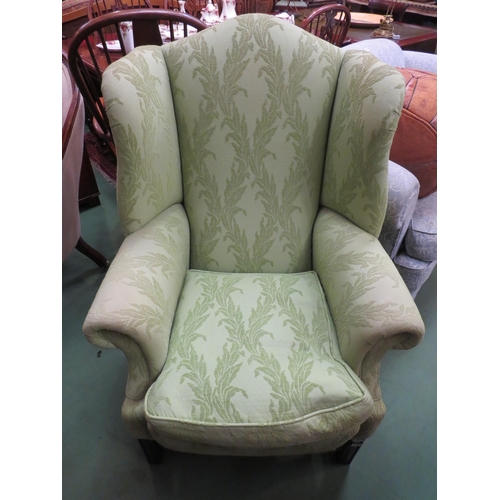 4189 - A pair of George III style wing back armchairs with scroll arms and feather filled cushions on reede... 