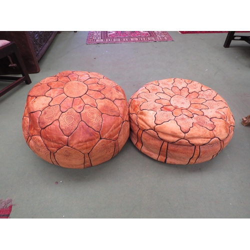 4190 - A pair of tooled leather pouffes , 60cm diameter