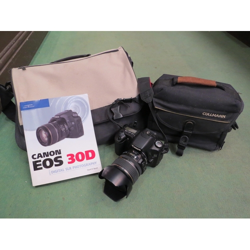 4257 - A Canon EOS 30D camera with case and instruction manual, together with assorted accessories includin... 