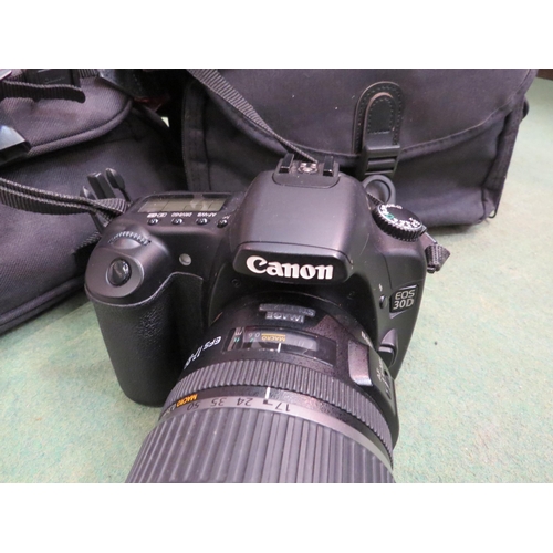 4257 - A Canon EOS 30D camera with case and instruction manual, together with assorted accessories includin... 