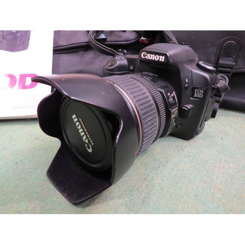 4257 - A Canon EOS 30D camera with case and instruction manual, together with assorted accessories includin... 