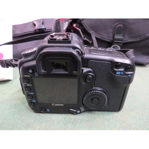 4257 - A Canon EOS 30D camera with case and instruction manual, together with assorted accessories includin... 