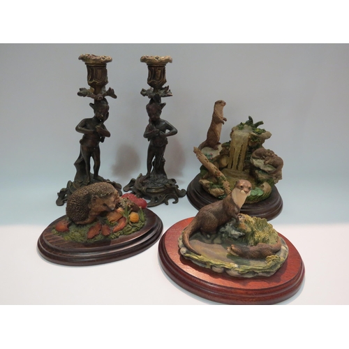 4273 - Three animal figural groups including Country Artists, an otter plaque and a pair of bronze effect f... 