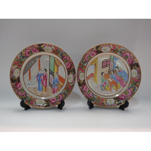 4280 - A pair of 19th Century Chinese Famille Rose cabinet plates, central figural scenes, gilt enriched fl... 