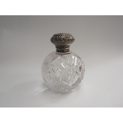 4358 - A silver topped glass scent bottle of globular form, 12cm tall