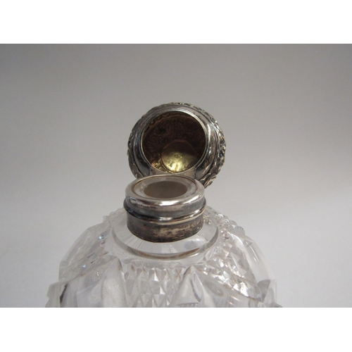 4358 - A silver topped glass scent bottle of globular form, 12cm tall