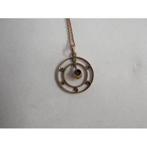 4400 - A 9ct gold chain hung with a circular pendant, 3.2g