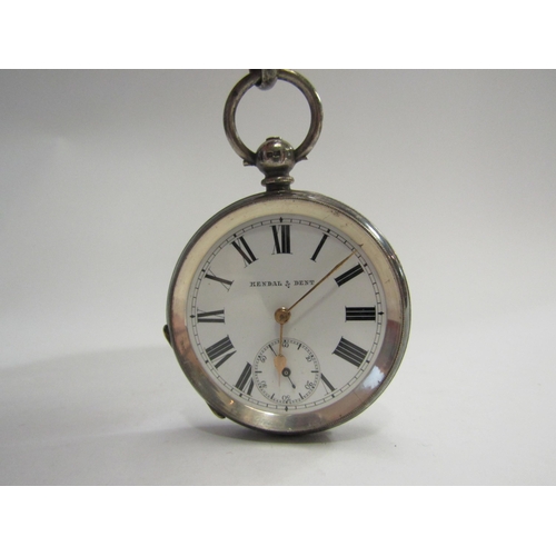 4409 - A Kendal & Dent silver cased pocket watch with graduated silver chain and fob