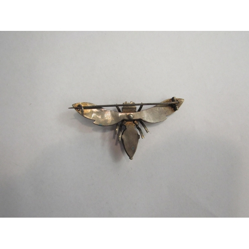 4412 - A garnet brooch as a fly, 6cm wide