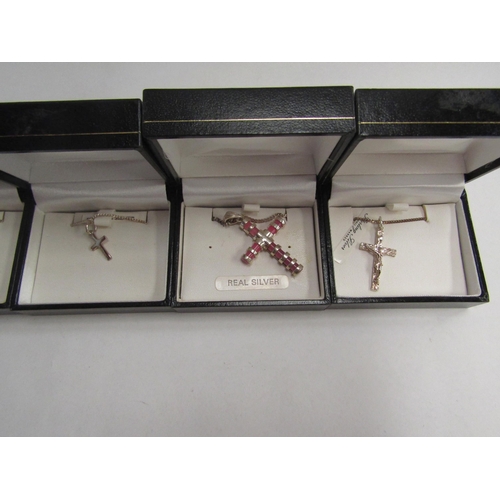 4429 - Five cross pendants and a crucifix pendant, all hung on 925/silver chains