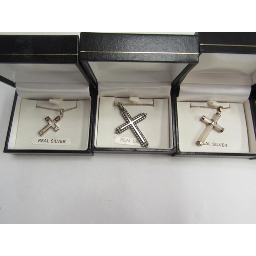 4429 - Five cross pendants and a crucifix pendant, all hung on 925/silver chains