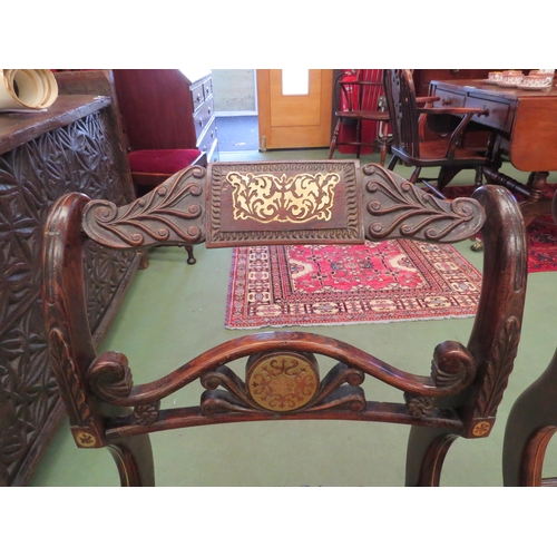 4053 - A pair of Regency hall chairs, simulated rosewood with brass inlay, carved back rest, cane seats on ... 