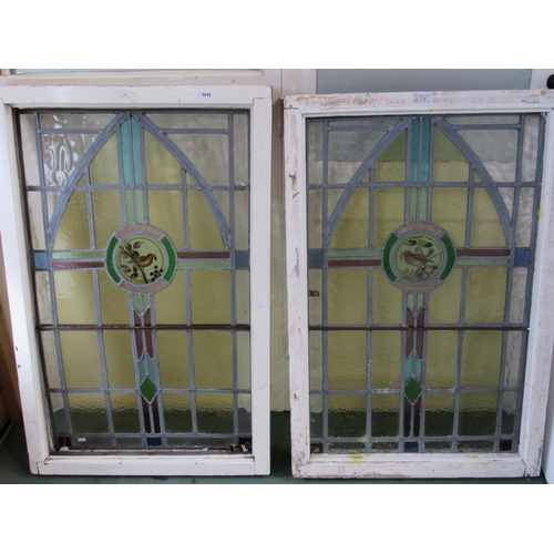 9045 - A pair of painted pine framed stained glass windows with central bird detail roundels, approx 29