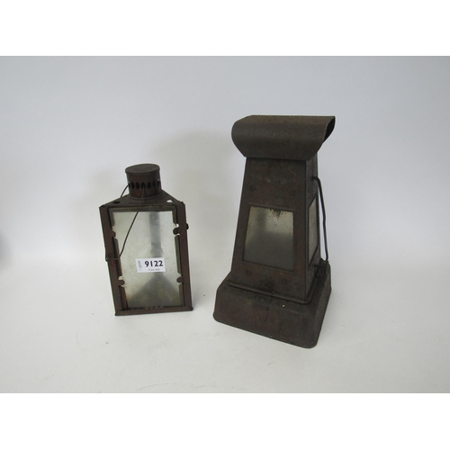 9122 - Two tinware candle lanterns