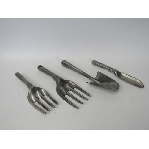 Two aluminium hand trowels and four forks