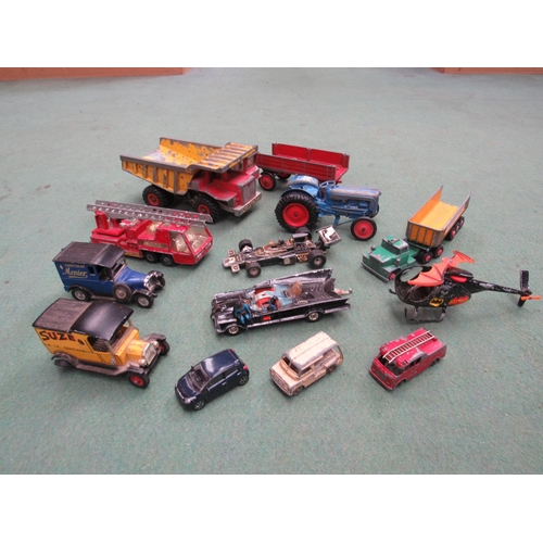 9167 - A collection of played with diecasts including Dinky Toys Aveling-Barford dump truck, Corgi Toys Bat... 